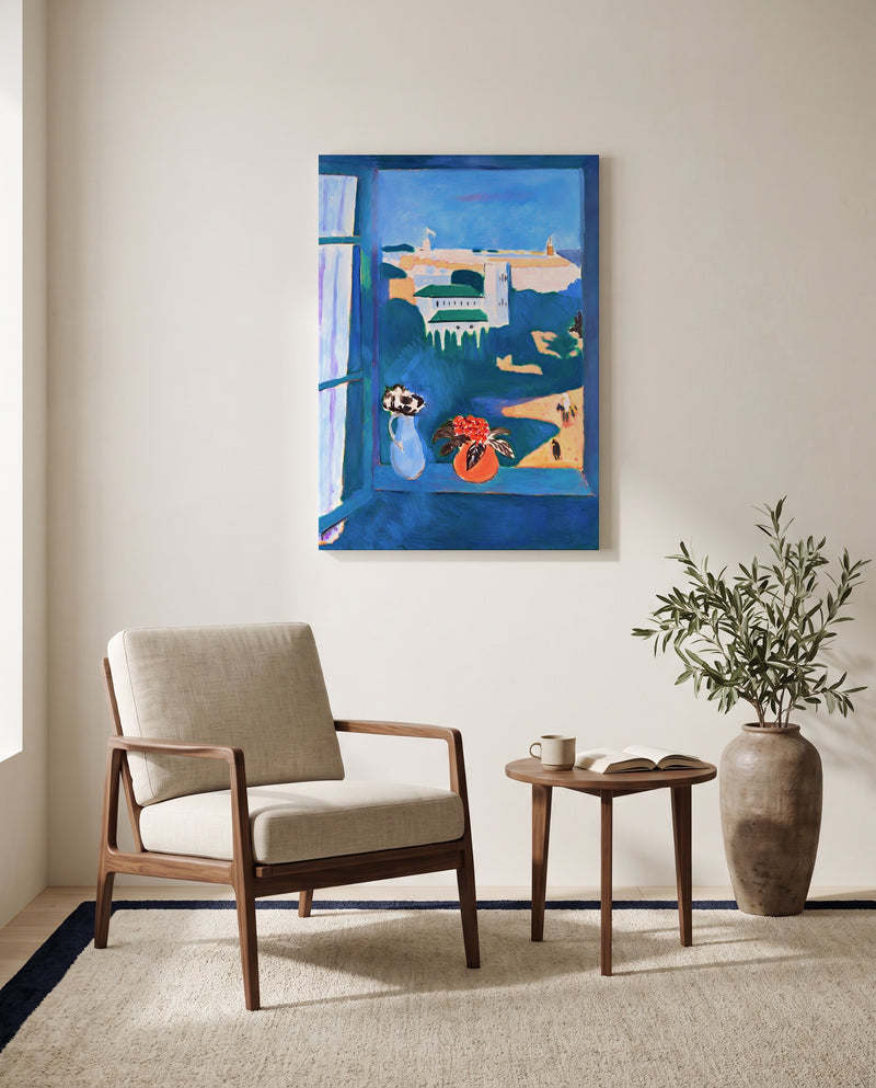 Window at Tangier by Henri Matisse as a stretched canvas above a linen lounge chair in a reading corner