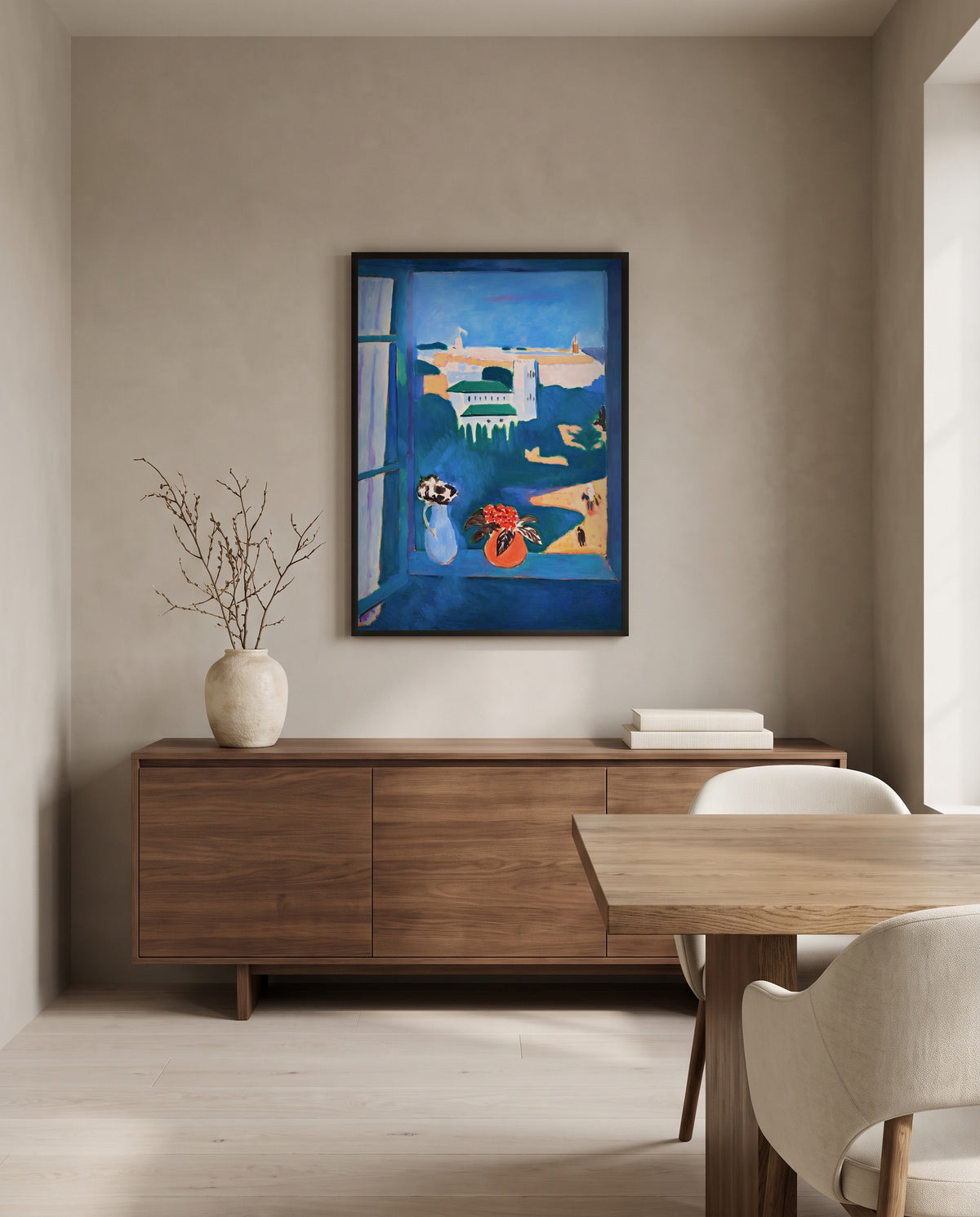 Window at Tangier by Henri Matisse in a black frame above a walnut sideboard in a dining room