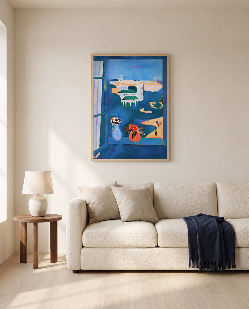 Window at Tangier by Henri Matisse framed in natural oak above a cream sofa in a warm living room