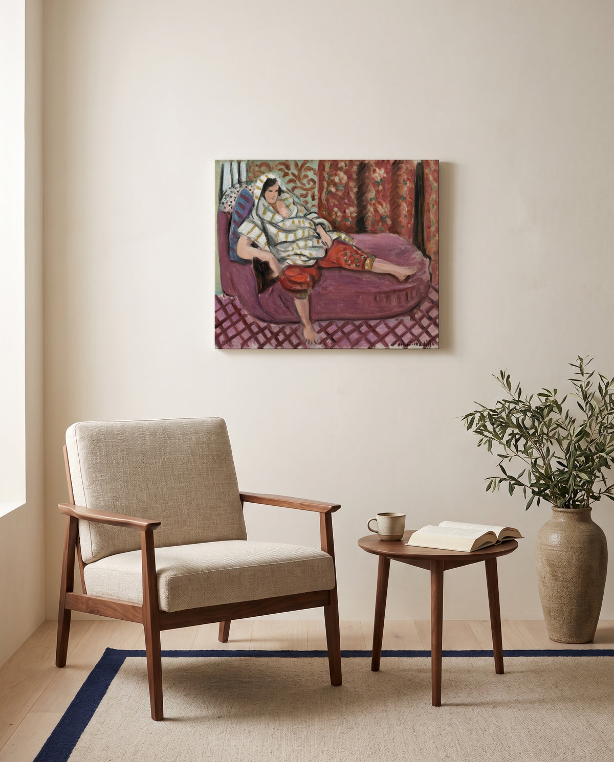 Woman on Rose Divan by Henri Matisse as a stretched canvas above a linen lounge chair in a reading corner