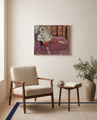 Woman on Rose Divan by Henri Matisse as a stretched canvas above a linen lounge chair in a reading corner