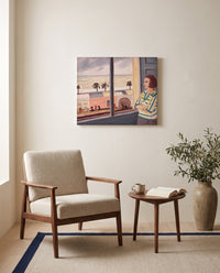 Young Woman at the Sea by Henri Matisse as a stretched canvas above a linen lounge chair in a reading corner