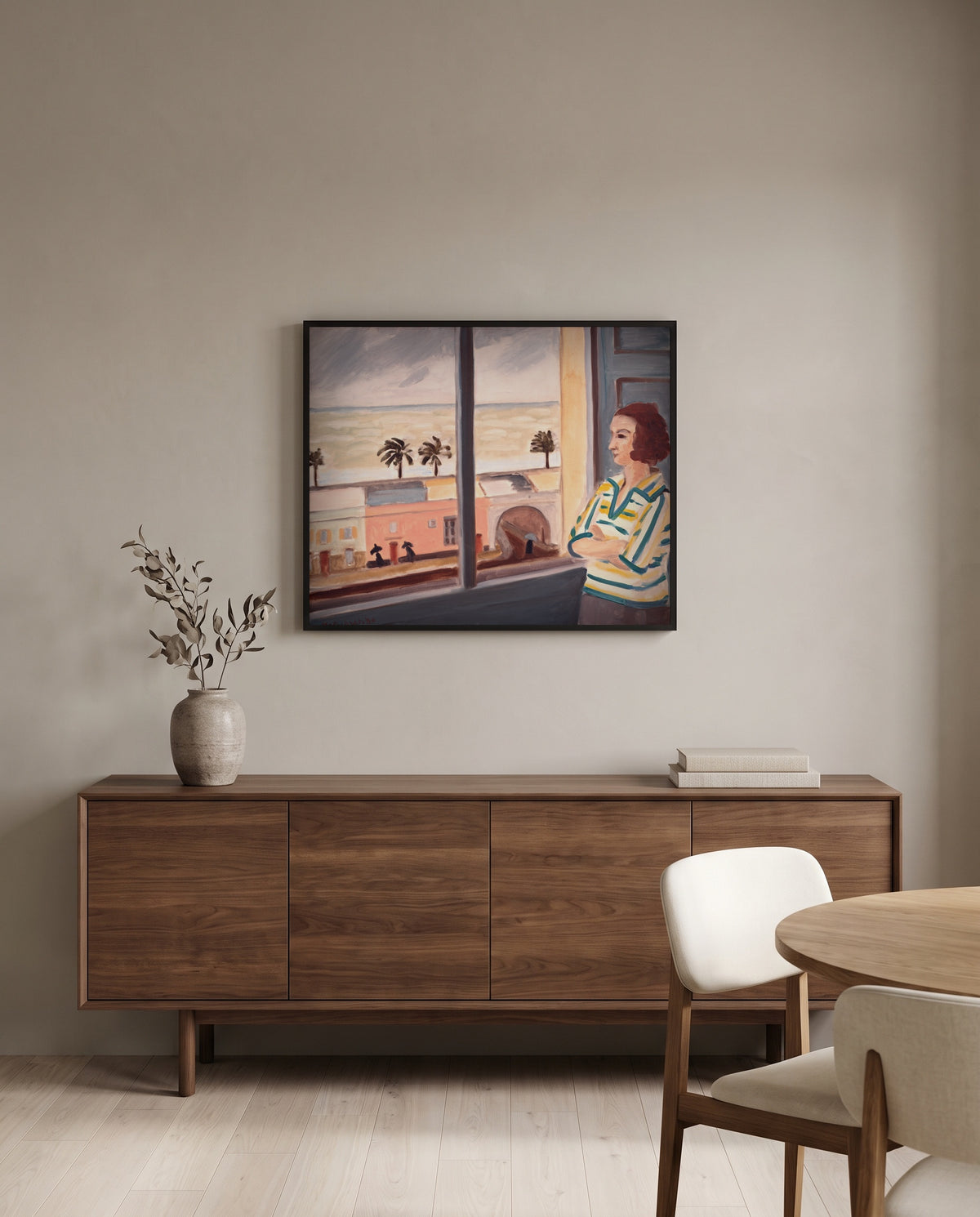 Young Woman at the Sea by Henri Matisse in a black frame above a walnut sideboard in a dining room
