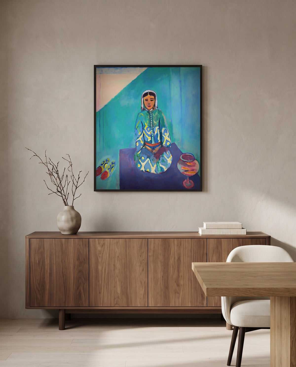 Zorah on the Terrace by Henri Matisse in a black frame above a walnut sideboard in a dining room