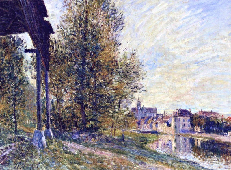 Near Moret-sur-Loing by Alfred Sisley: tall trees and a wooden shed by a canal, the town of Moret under a pale blue sky