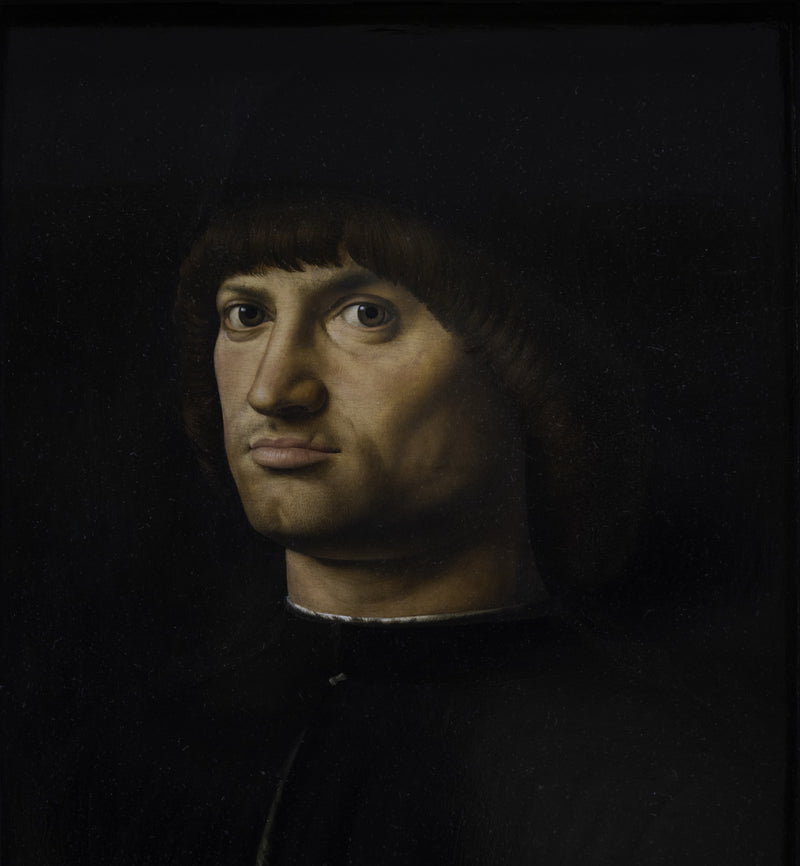 Il Condottiere by Antonello da Messina: a man in a black cap and coat, with a scar on his lip, looks straight at us