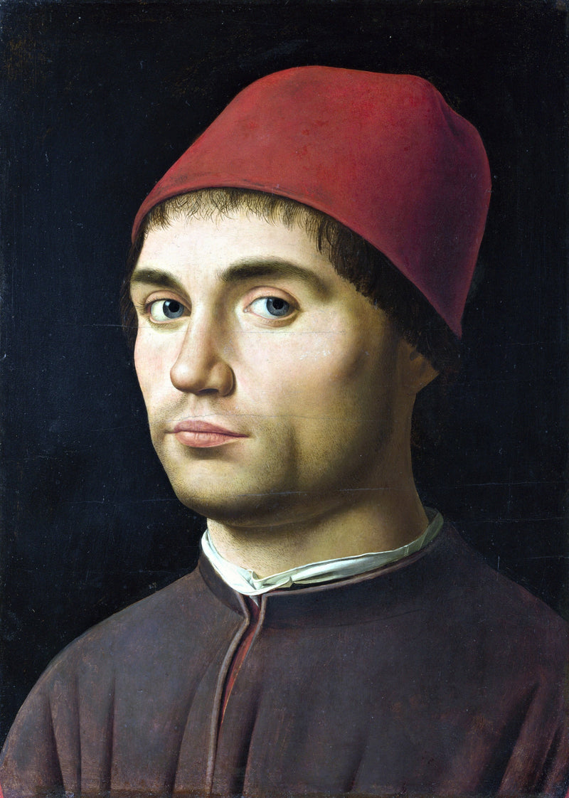 Portrait of a Man by Antonello da Messina: a young man in a red cap and dark coat looks out from a black background