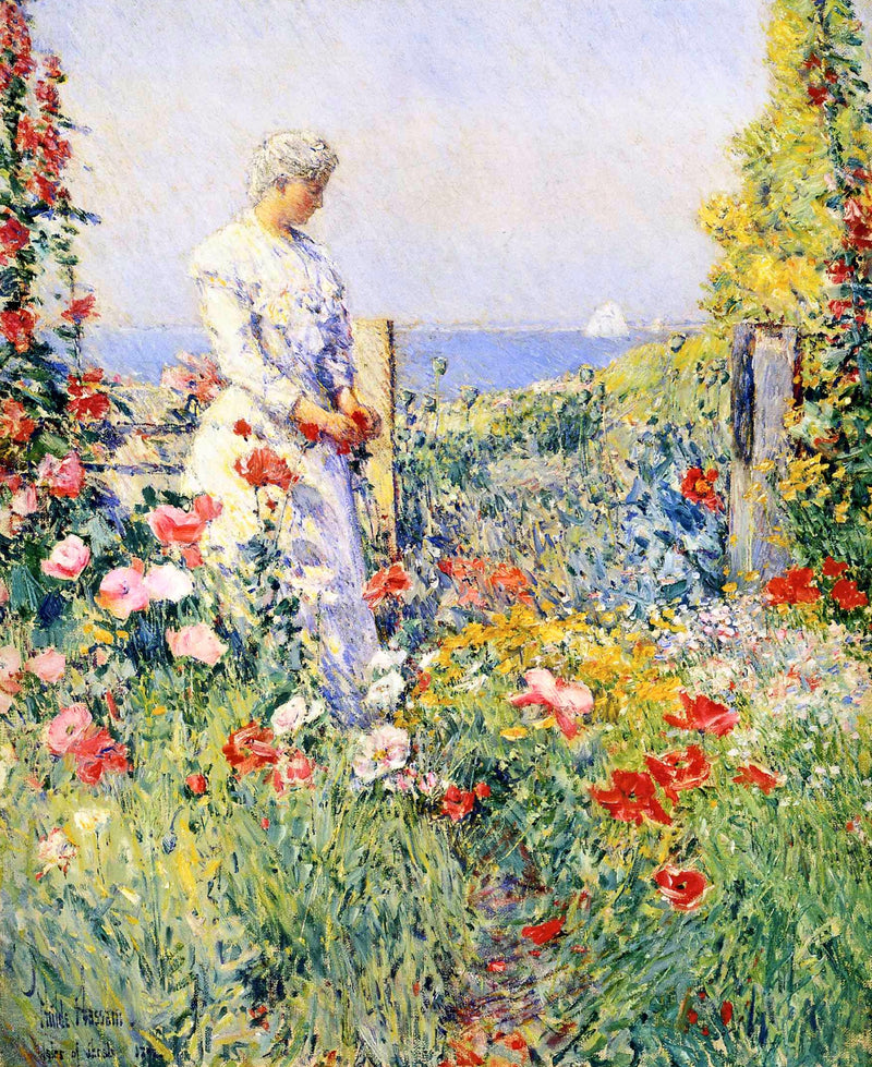 In the Garden by Childe Hassam: a woman in white among red poppies and hollyhocks, the blue sea and a sail beyond