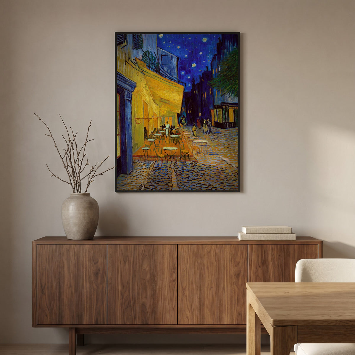 Van Gogh's Café Terrace at Night in a black frame above a walnut sideboard