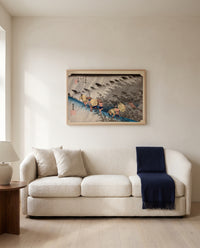 Driving Rain at Shōno by Utagawa Hiroshige framed in natural oak above a cream sofa in a warm living room