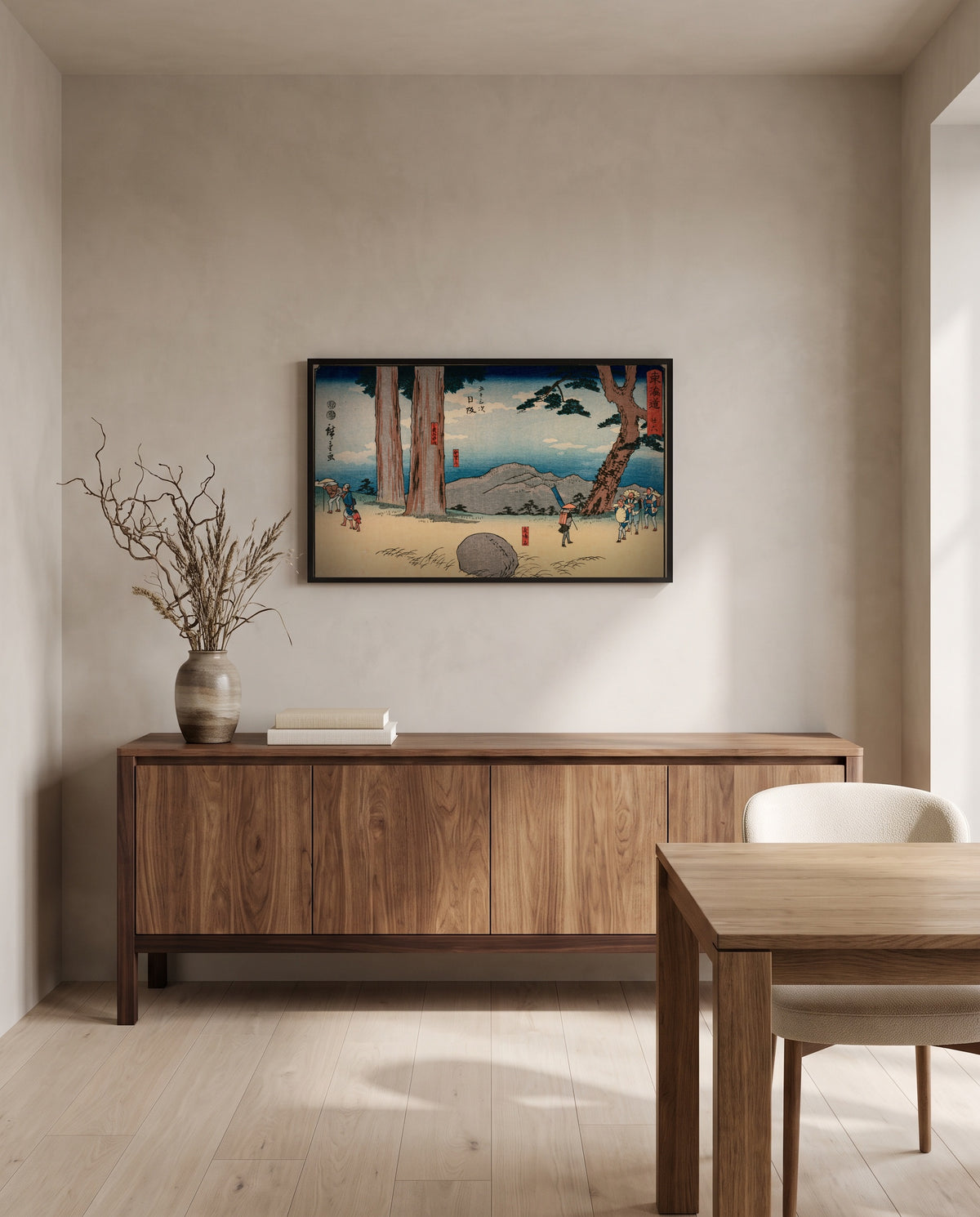 Night-Weeping Stone by Utagawa Hiroshige in a black frame above a walnut sideboard in a dining room