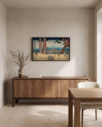 Night-Weeping Stone by Utagawa Hiroshige in a black frame above a walnut sideboard in a dining room