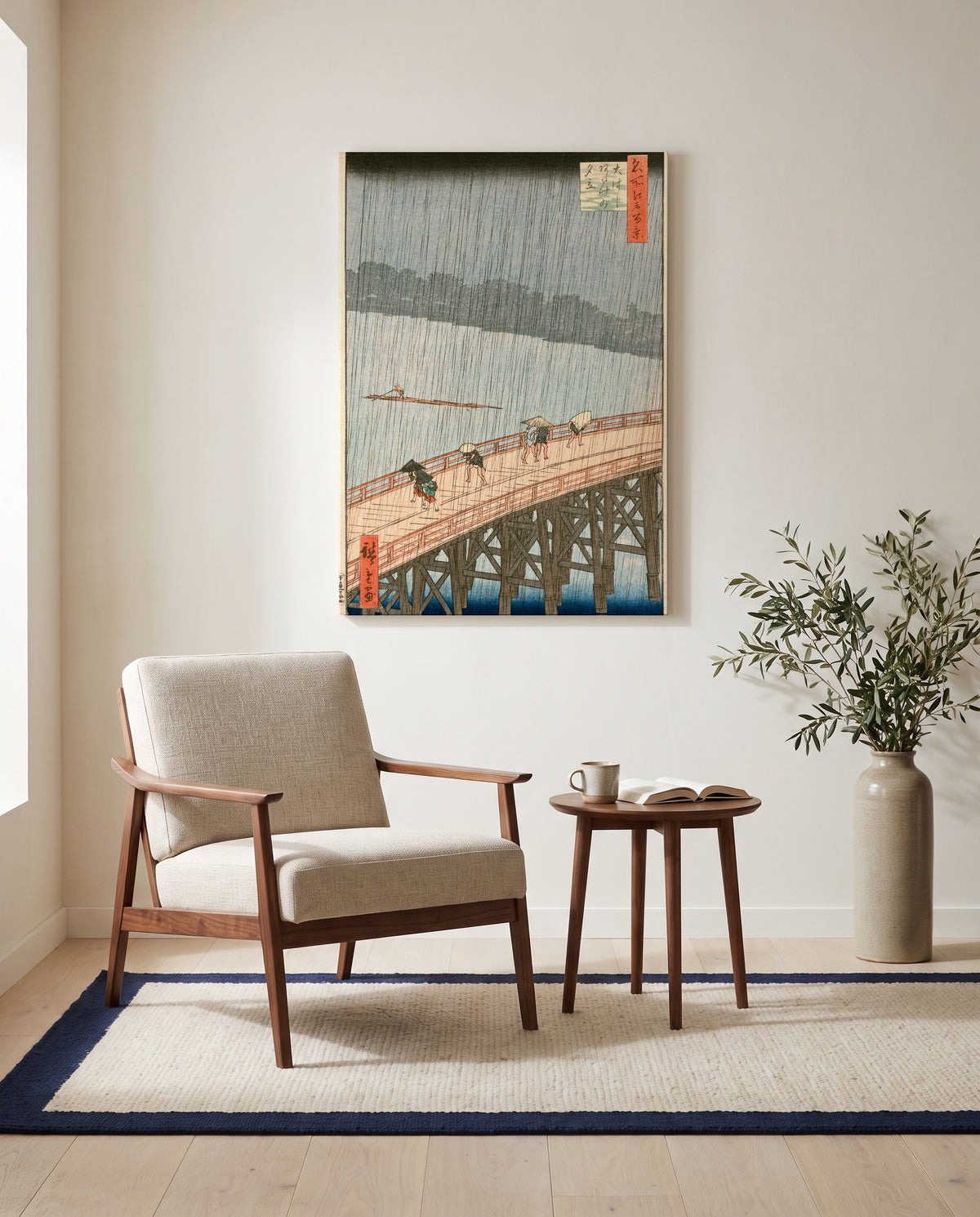 Sudden Shower at Ōhashi by Utagawa Hiroshige as a stretched canvas above a linen lounge chair in a reading corner
