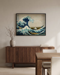 The Great Wave of Kanagawa by Katsushika Hokusai in a black frame above a walnut sideboard in a dining room