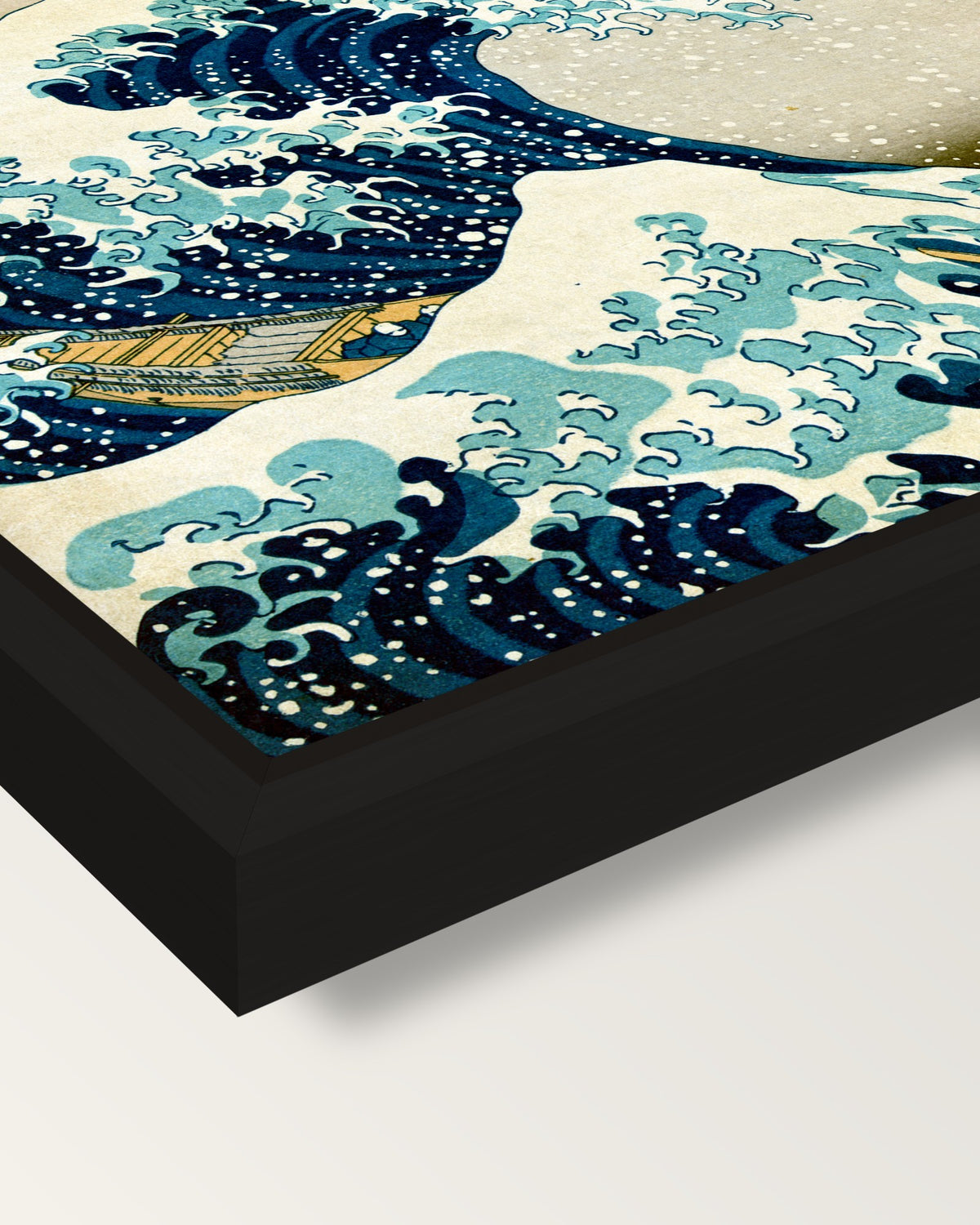 The Great Wave of Kanagawa framed canvas, corner close-up: a black floating frame with a shadow gap round the canvas