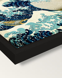 The Great Wave of Kanagawa framed canvas, corner close-up: a black floating frame with a shadow gap round the canvas