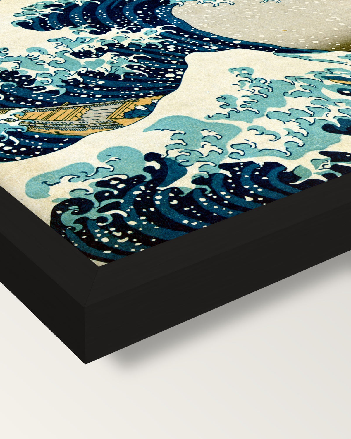The Great Wave of Kanagawa framed print, corner close-up: black moulding, mitred, the print set just below its edge