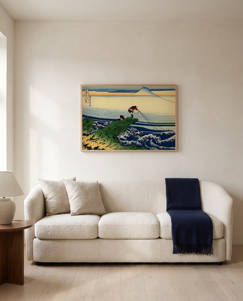 Kajikazawa in Kai Province by Katsushika Hokusai framed in natural oak above a cream sofa in a warm living room