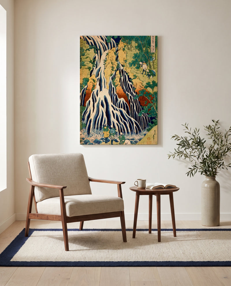 Kirifuri Waterfall by Katsushika Hokusai as a stretched canvas above a linen lounge chair in a reading corner