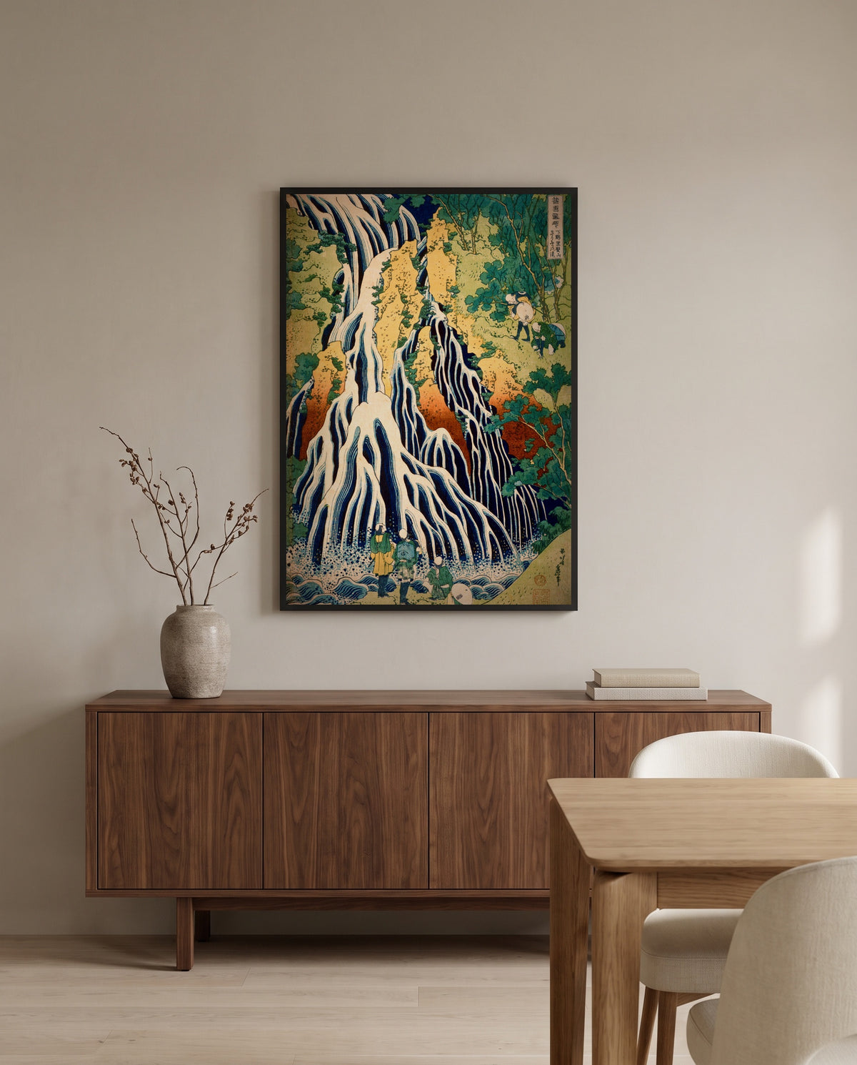Kirifuri Waterfall by Katsushika Hokusai in a black frame above a walnut sideboard in a dining room