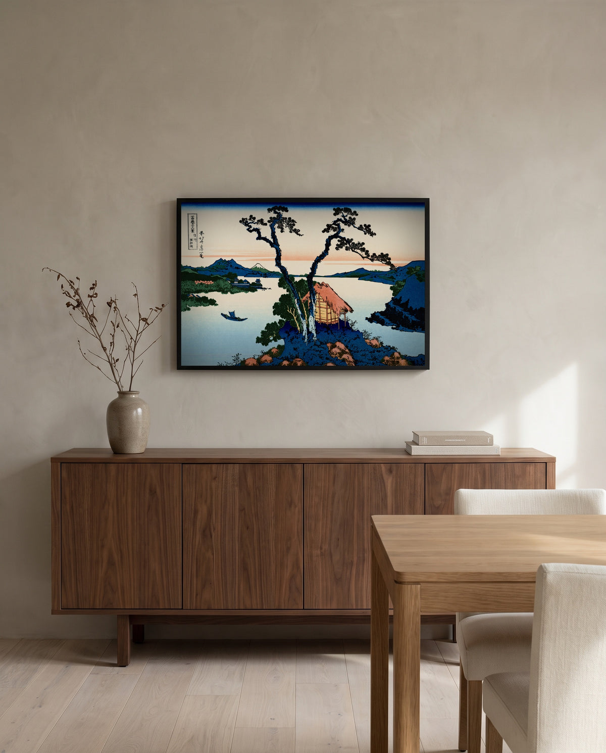 Lake Suwa in Shinano Province by Katsushika Hokusai in a black frame above a walnut sideboard in a dining room