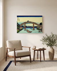 Under Mannen Bridge at Fukagawa by Katsushika Hokusai as a stretched canvas above a linen lounge chair in a reading corner