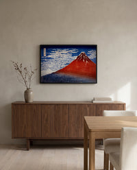 Red Fuji by Katsushika Hokusai in a black frame above a walnut sideboard in a dining room