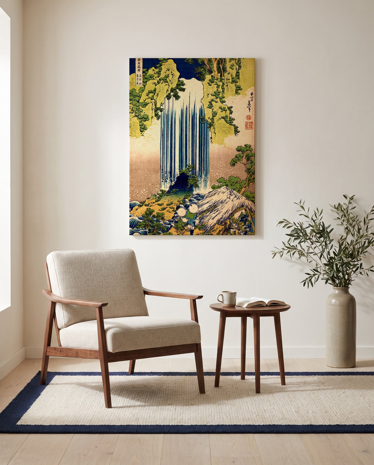 Yōrō Waterfall by Katsushika Hokusai as a stretched canvas above a linen lounge chair in a reading corner