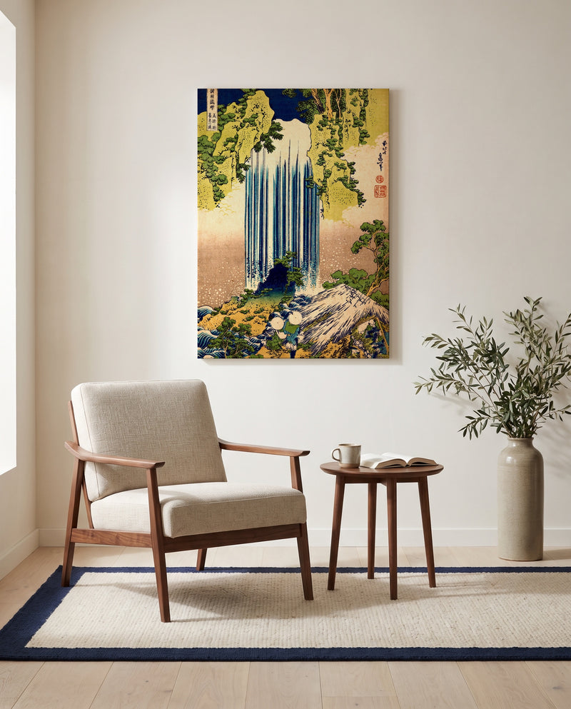 Yōrō Waterfall by Katsushika Hokusai as a stretched canvas above a linen lounge chair in a reading corner