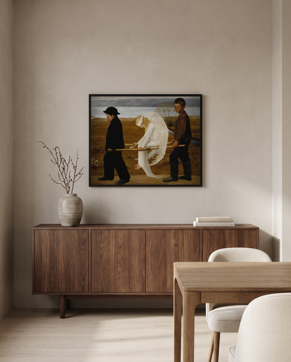 The Wounded Angel by Hugo Simberg in a black frame above a walnut sideboard in a dining room