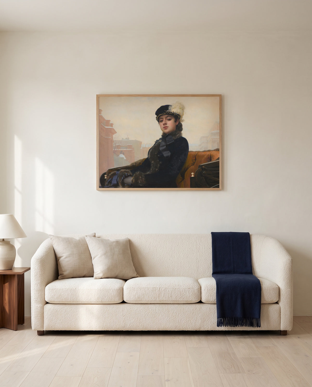 Unknown Woman by Ivan Kramskoi framed in natural oak above a cream sofa in a warm living room