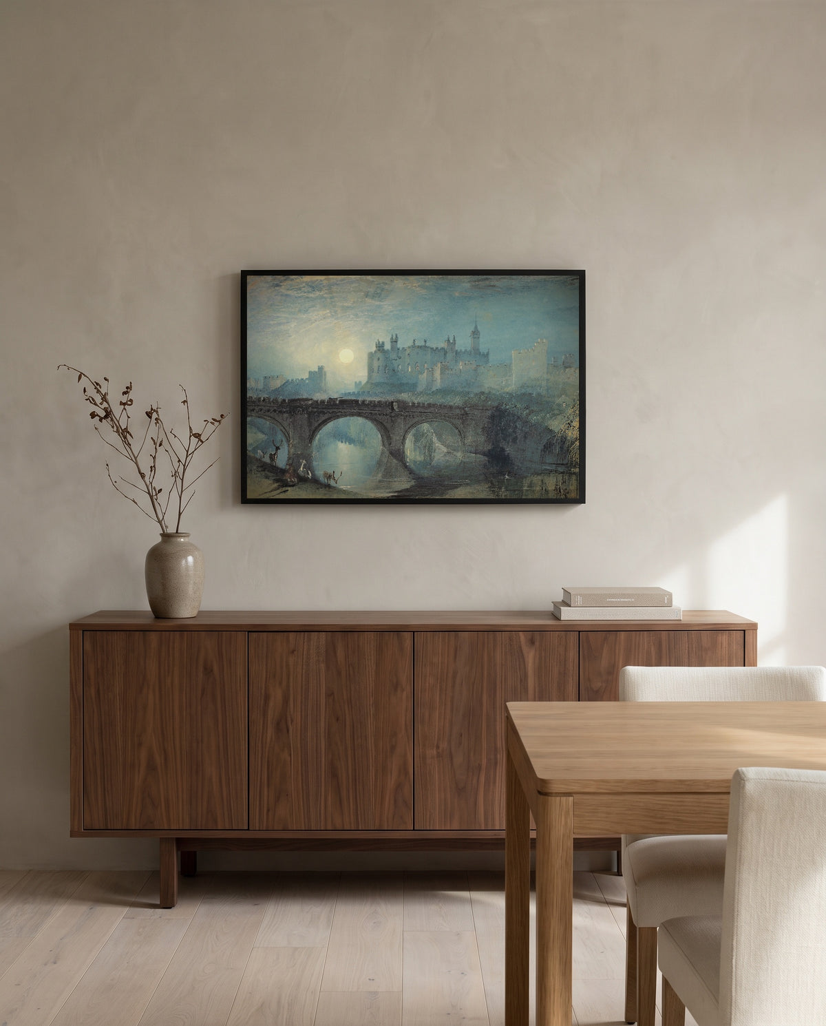 Alnwick Castle by J. M. W. Turner in a black frame above a walnut sideboard in a dining room