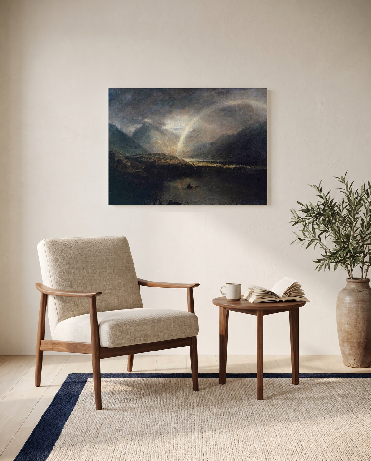 Buttermere Lake by J. M. W. Turner as a stretched canvas above a linen lounge chair in a reading corner