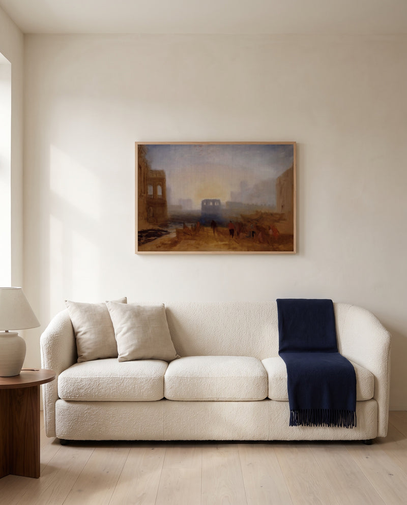 Claudian Harbour Scene by J. M. W. Turner framed in natural oak above a cream sofa in a warm living room