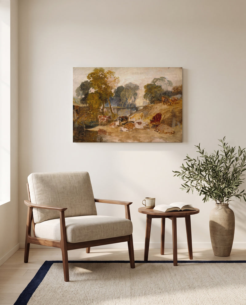 Cows with a Footbridge by J. M. W. Turner as a stretched canvas above a linen lounge chair in a reading corner