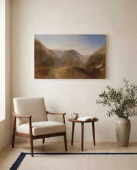 Civita di Bagnoregio by J. M. W. Turner as a stretched canvas above a linen lounge chair in a reading corner