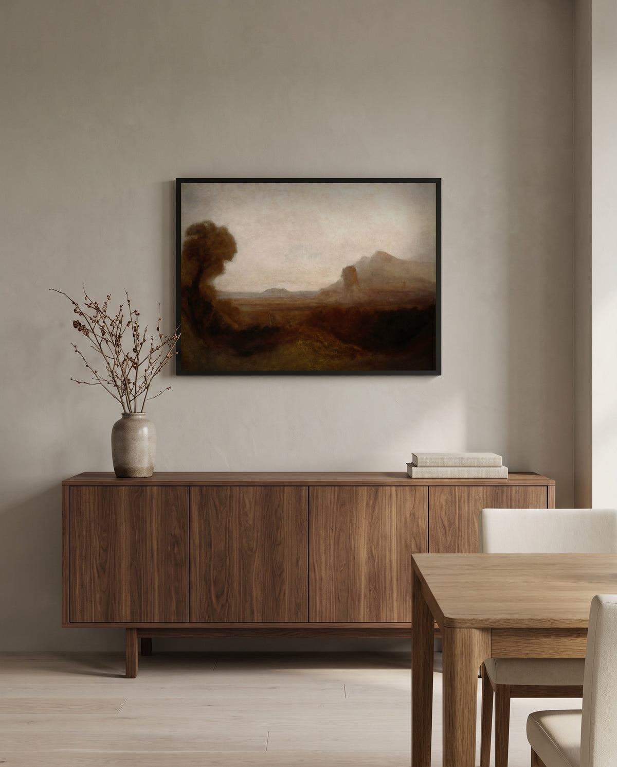 Italian Landscape with Tower by J. M. W. Turner in a black frame above a walnut sideboard in a dining room