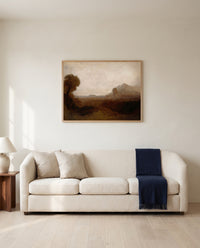 Italian Landscape with Tower by J. M. W. Turner framed in natural oak above a cream sofa in a warm living room