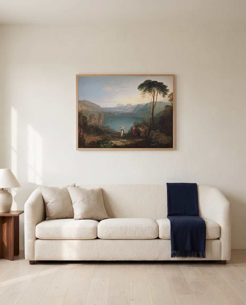 Lake Avernus by J. M. W. Turner framed in natural oak above a cream sofa in a warm living room
