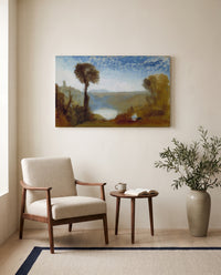 Lake Nemi by J. M. W. Turner as a stretched canvas above a linen lounge chair in a reading corner