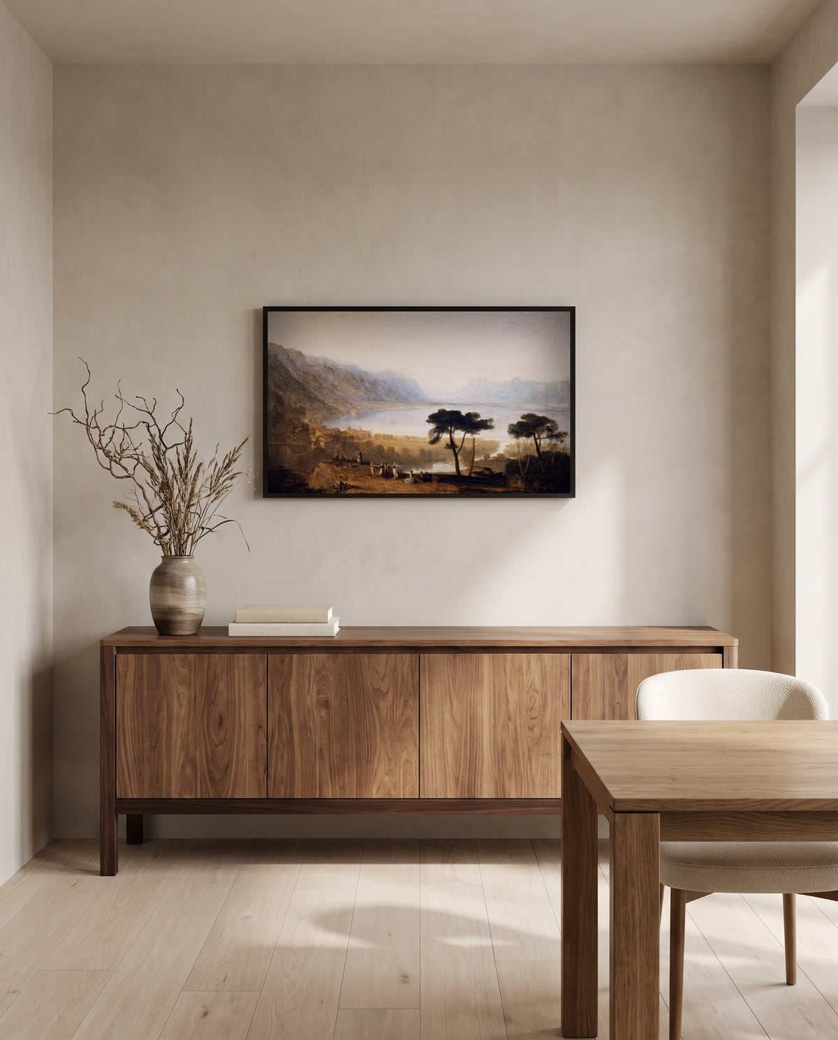 Lake of Geneva by J. M. W. Turner in a black frame above a walnut sideboard in a dining room