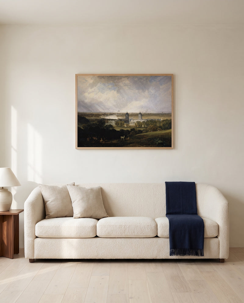 London from Greenwich Park by J. M. W. Turner framed in natural oak above a cream sofa in a warm living room