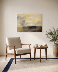 Margate, from the Sea by J. M. W. Turner as a stretched canvas above a linen lounge chair in a reading corner