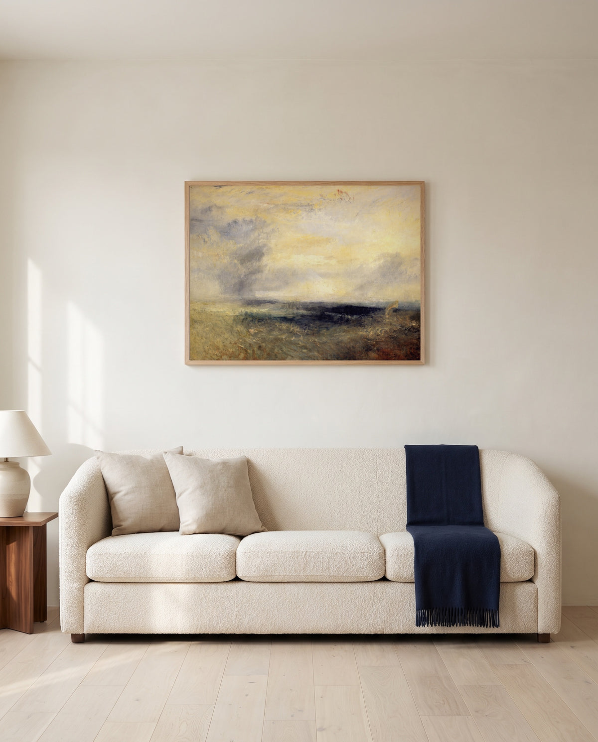 Margate, from the Sea by J. M. W. Turner framed in natural oak above a cream sofa in a warm living room