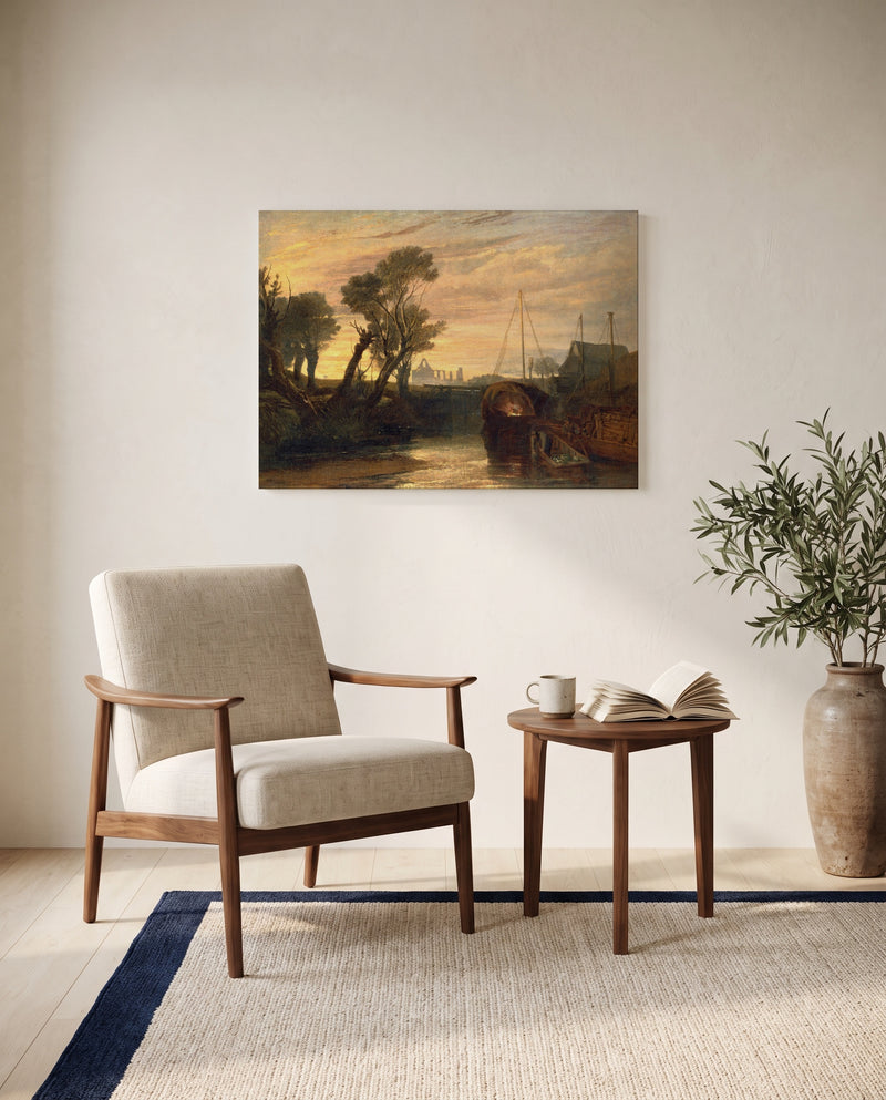 Newark Abbey by J. M. W. Turner as a stretched canvas above a linen lounge chair in a reading corner