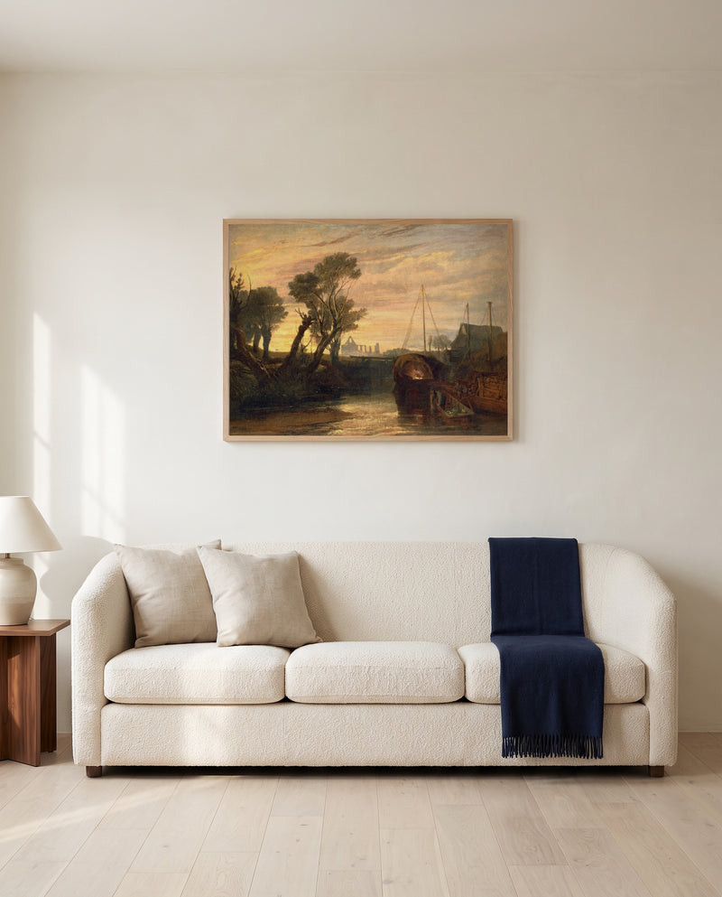 Newark Abbey by J. M. W. Turner framed in natural oak above a cream sofa in a warm living room