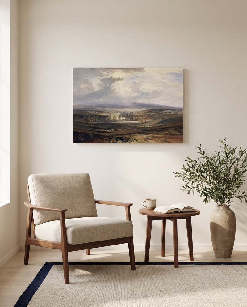 Raby Castle by J. M. W. Turner as a stretched canvas above a linen lounge chair in a reading corner