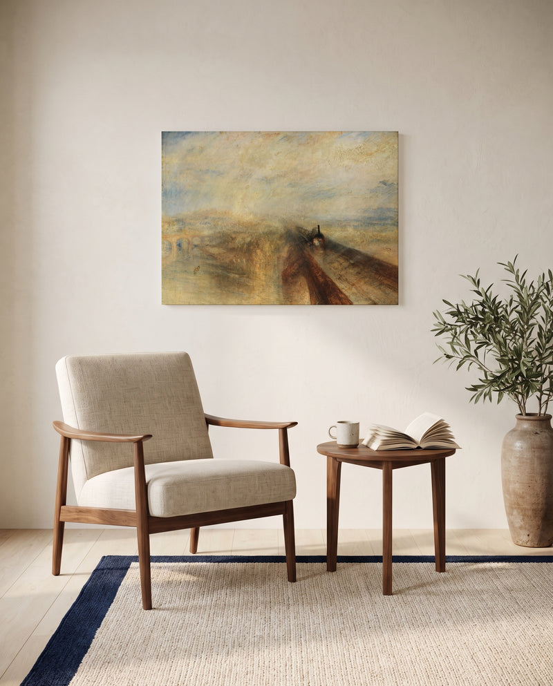 Rain, Steam and Speed by J. M. W. Turner as a stretched canvas above a linen lounge chair in a reading corner