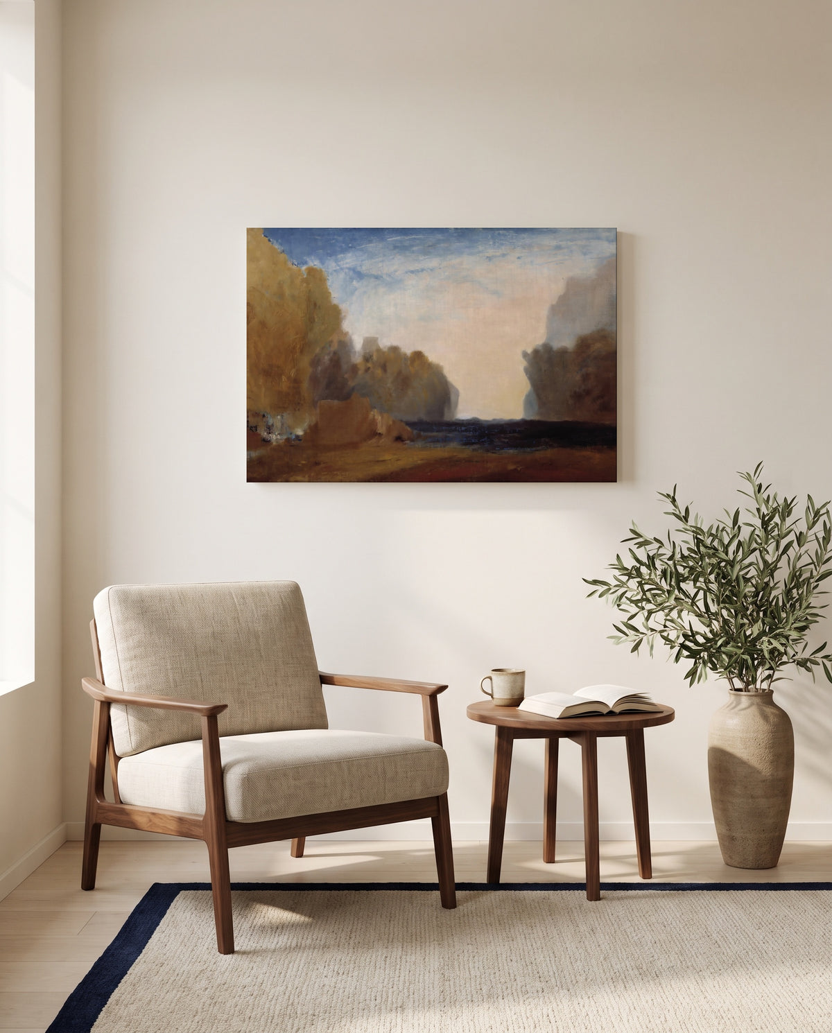 Rocky Bay by J. M. W. Turner as a stretched canvas above a linen lounge chair in a reading corner