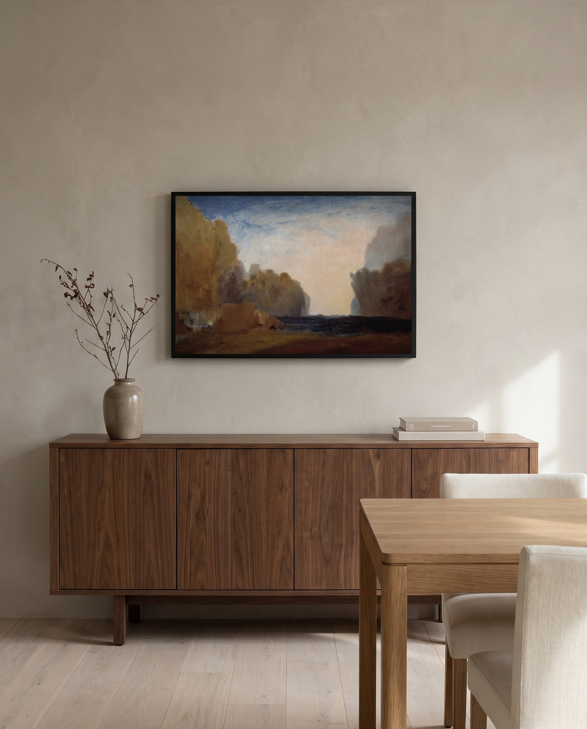 Rocky Bay by J. M. W. Turner in a black frame above a walnut sideboard in a dining room